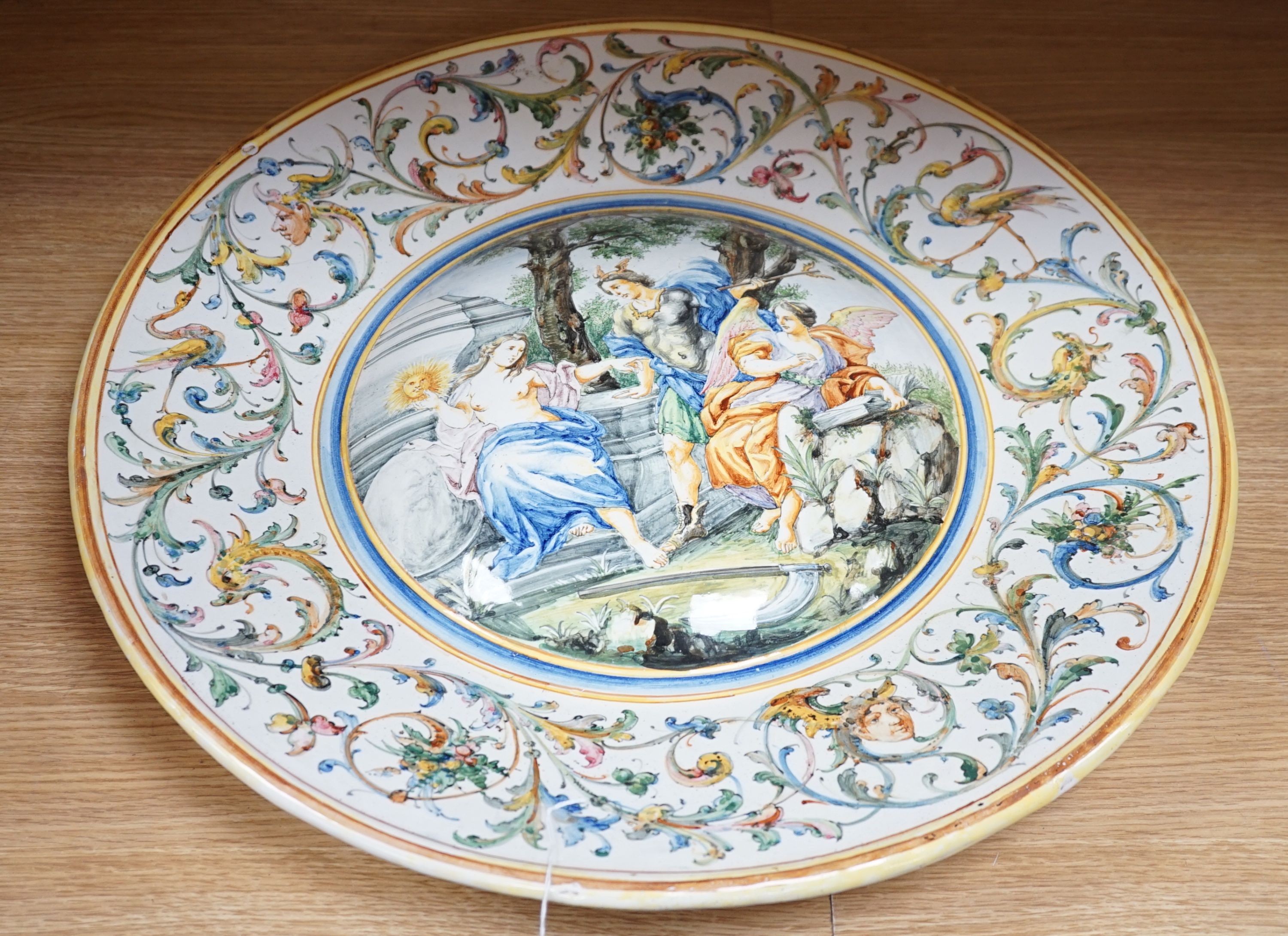 A 19th century large Italian majolica charger, AVF mark, 55cm high.